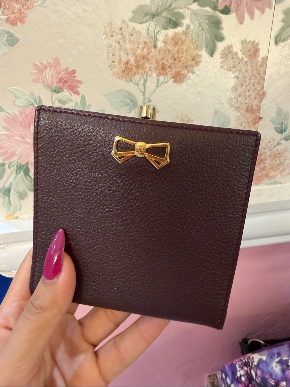 Nina Ricci Plum Pebbled Leather Wallet with Gold Bow Accent